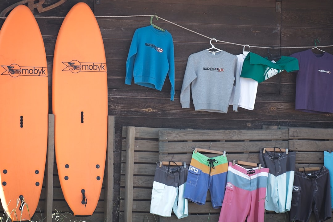 Surfboards and apparel displayed outside a shop.